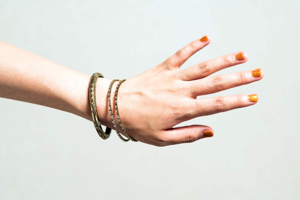 Woman wearing a bangle bracelet, 5 Great Ways To Wear A Bangle Bracelet