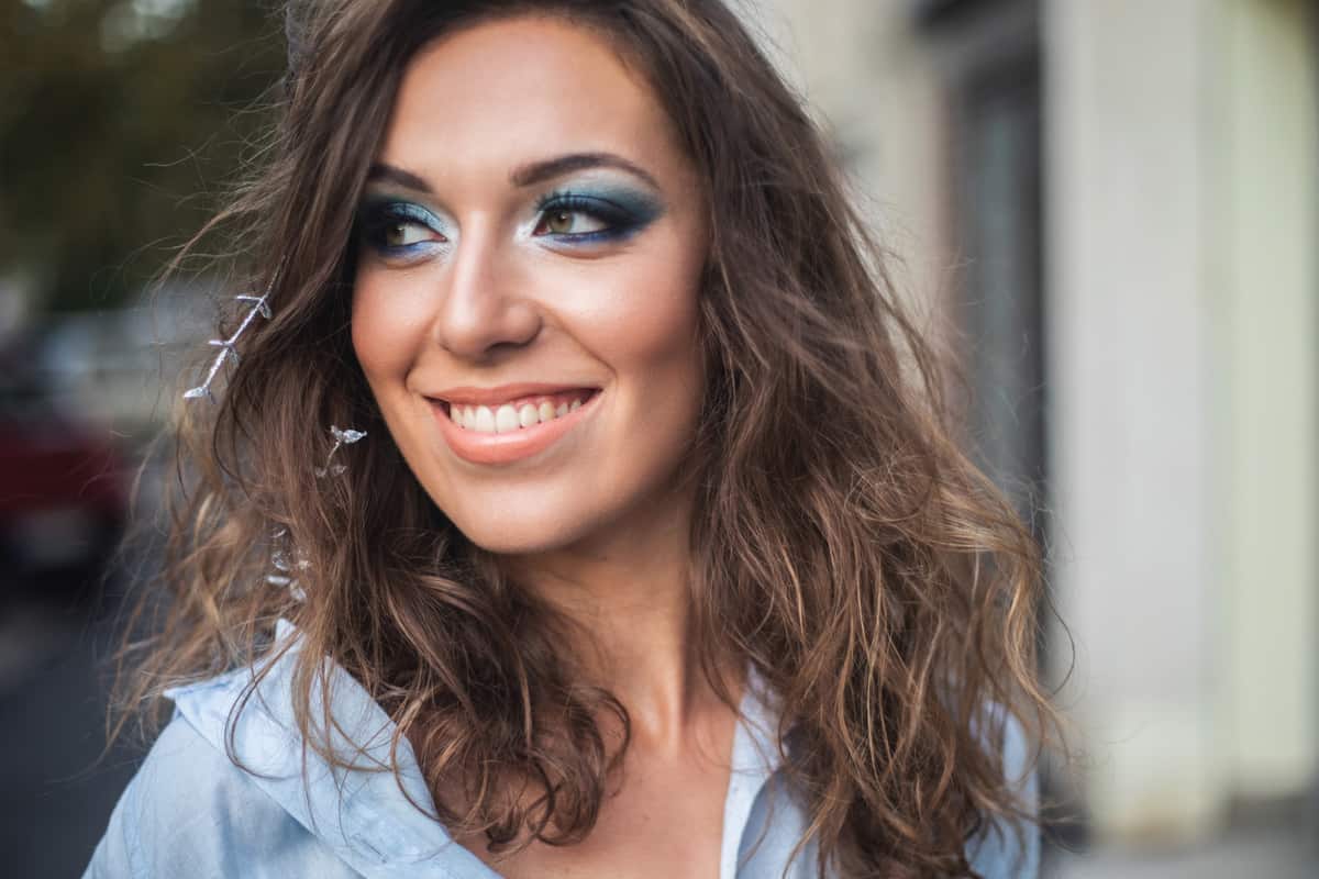 Young woman with professionally done make-up.