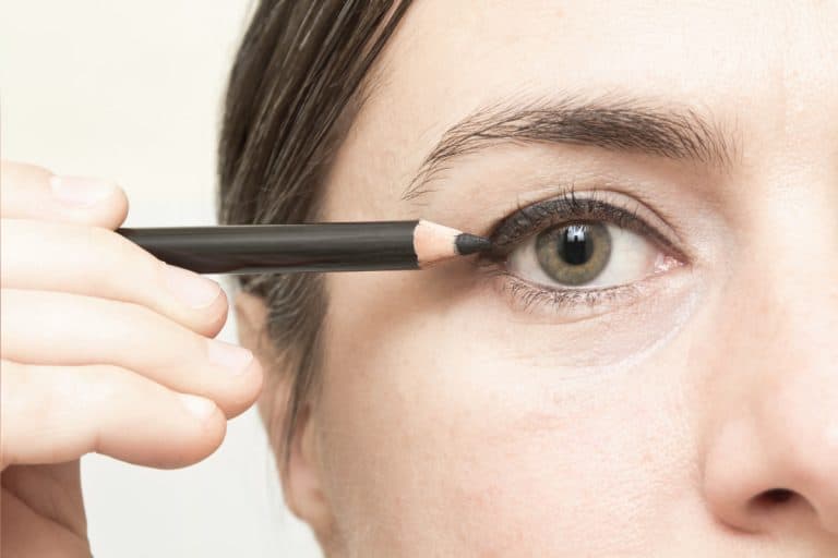middle aged woman applying eyeliner makeup. 6 Of The Best Eyeliners For Older Women