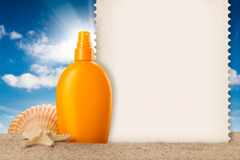 An up close photo of a sunscreen on the beach