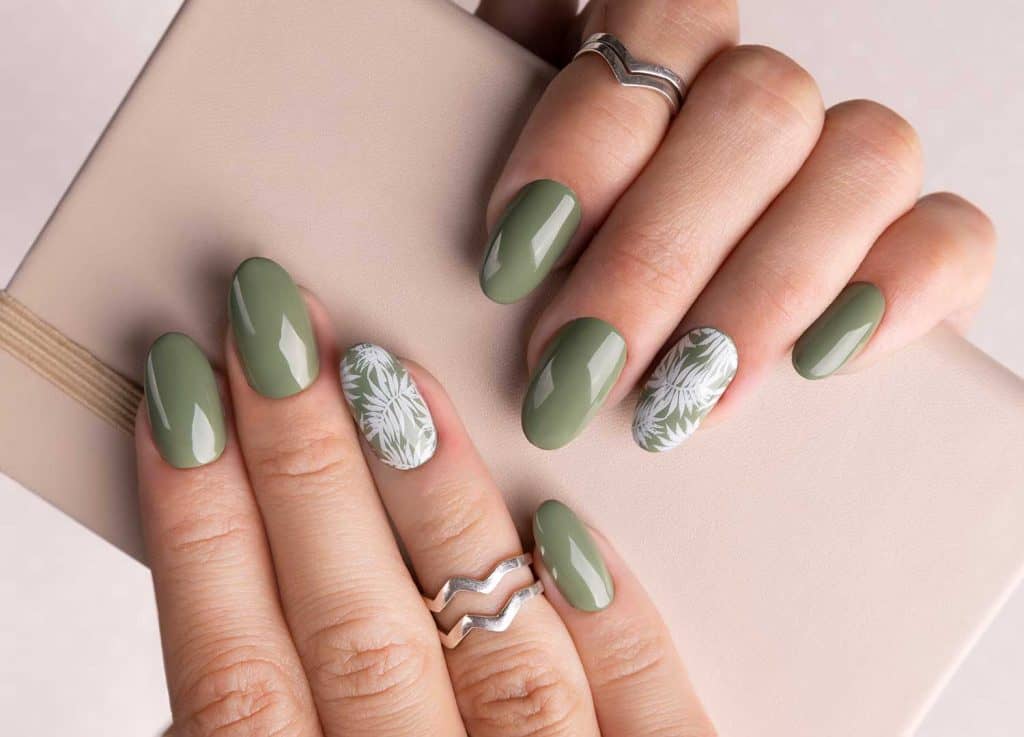Beautiful woman's hands with spring summer floral nail design