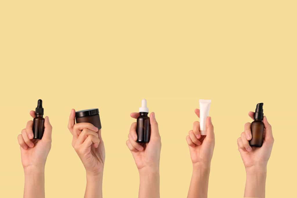 Different varieties of face cleanser on a yellow background