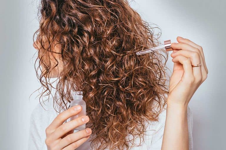 Female using cosmetic serum to prevent split ends, How Often Should You Use Hair Serum?