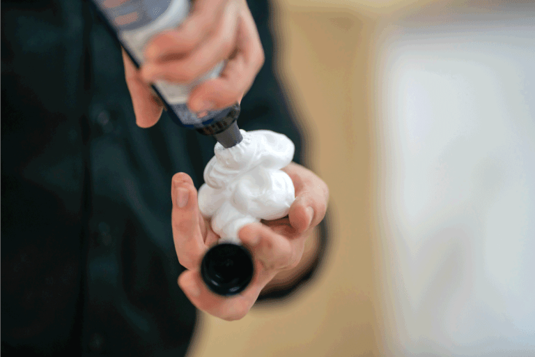 Pouring hair mousse on hand. 5 Types Of Hair Mousse To Know
