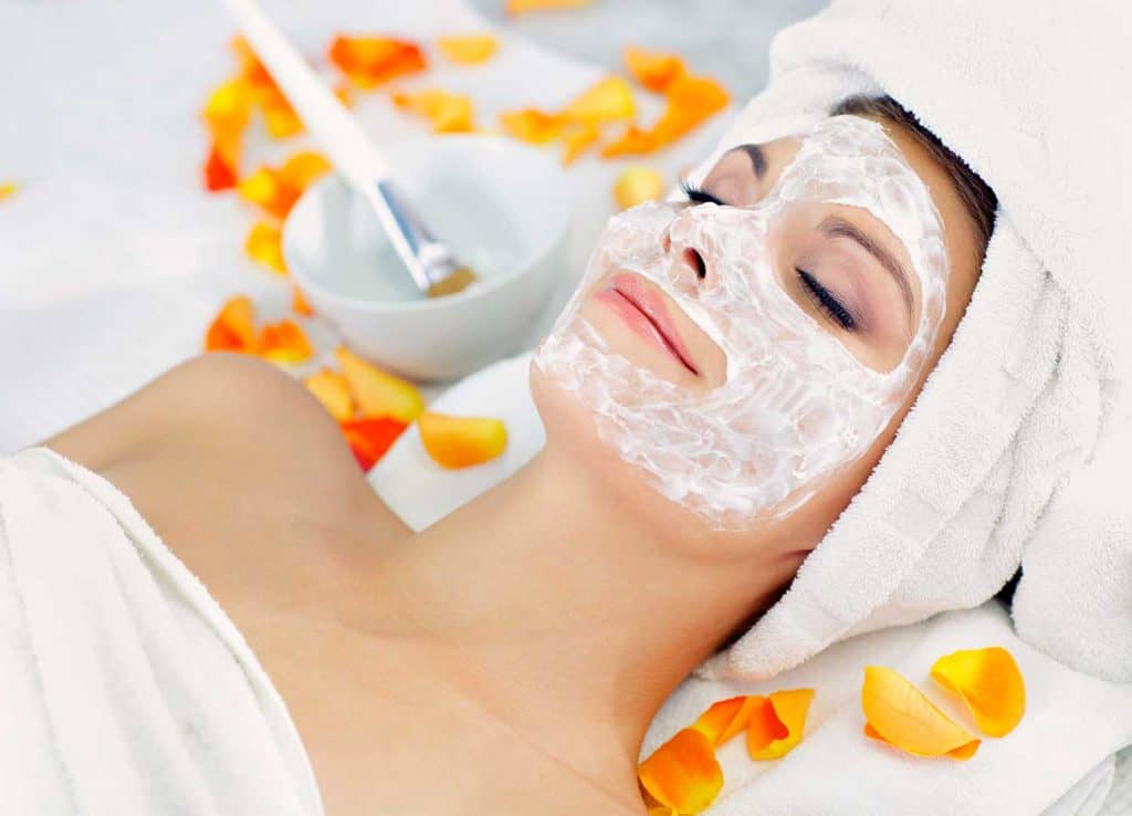 A woman getting a beauty mask at a spa