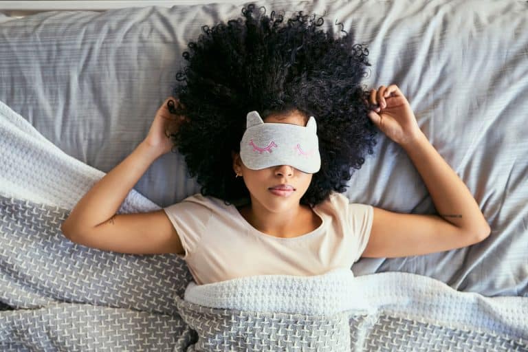 A woman sleeping with her eye mask on, How To Use A Gel Bead Eye Mask