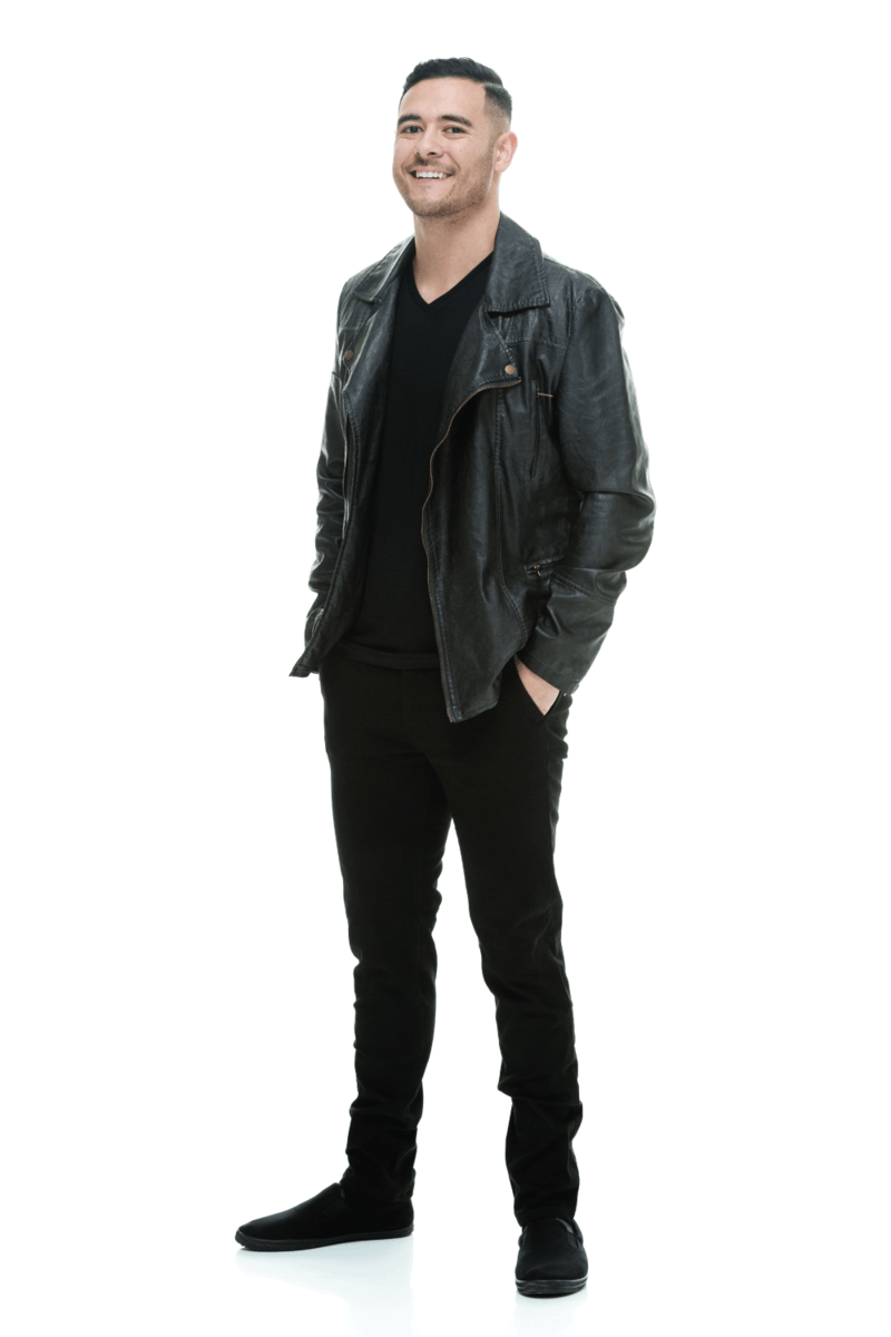 Happy man posing wearing leather jacket and flat slip on shoes