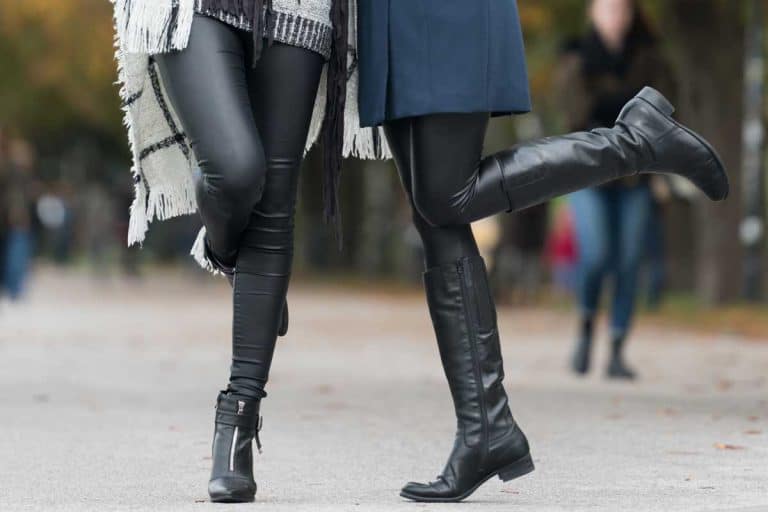 Two female friends wearing leggings and boots, Should Boots Match Leggings? [And Should You Tuck Leggings In?]