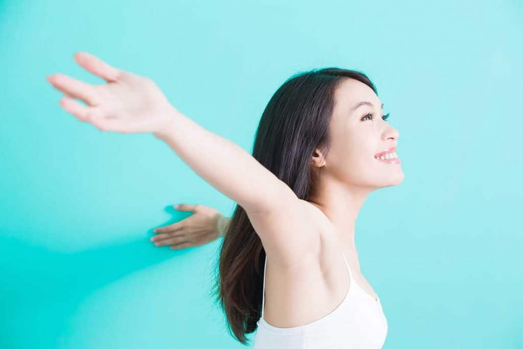 Woman smiling happily and feeling free
