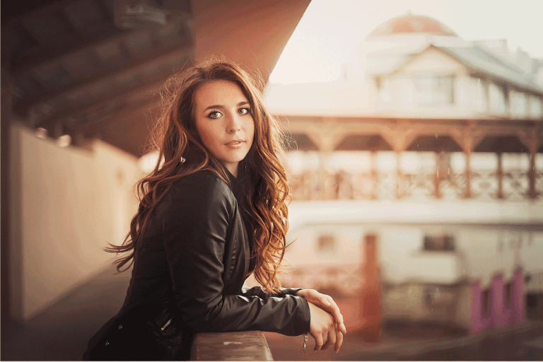 Young girl with long hair wearing leather jacket in the urban landscape. How Long Should A Leather Jacket Last