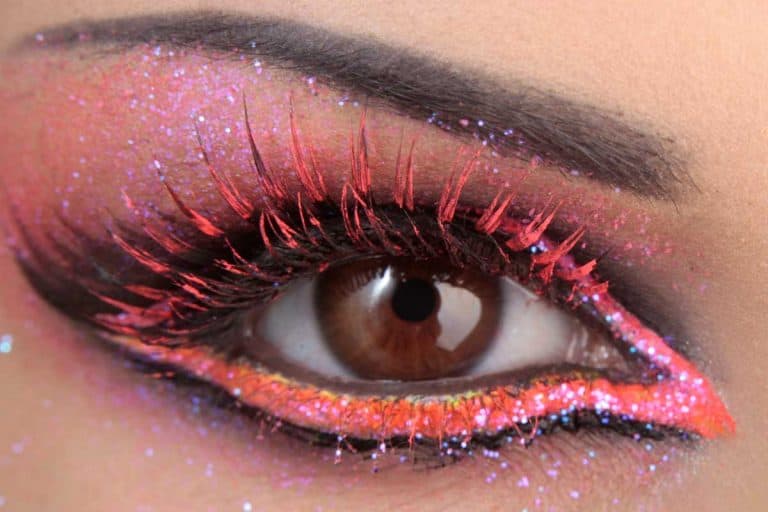 Beautiful woman with colorful eye makeup, Should Eyeliner And Mascara Match? [The Answer Might Surprise You!]