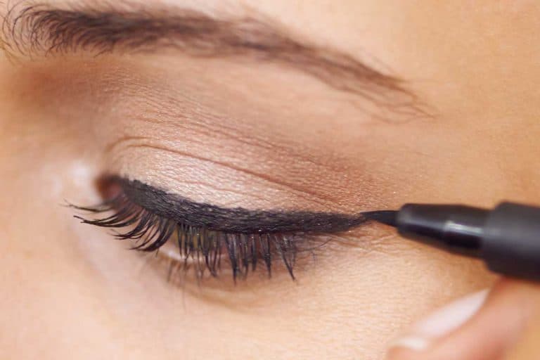 Close up of a young woman getting liner applied to her eyes, 11 Types Of Eyeliners To Know
