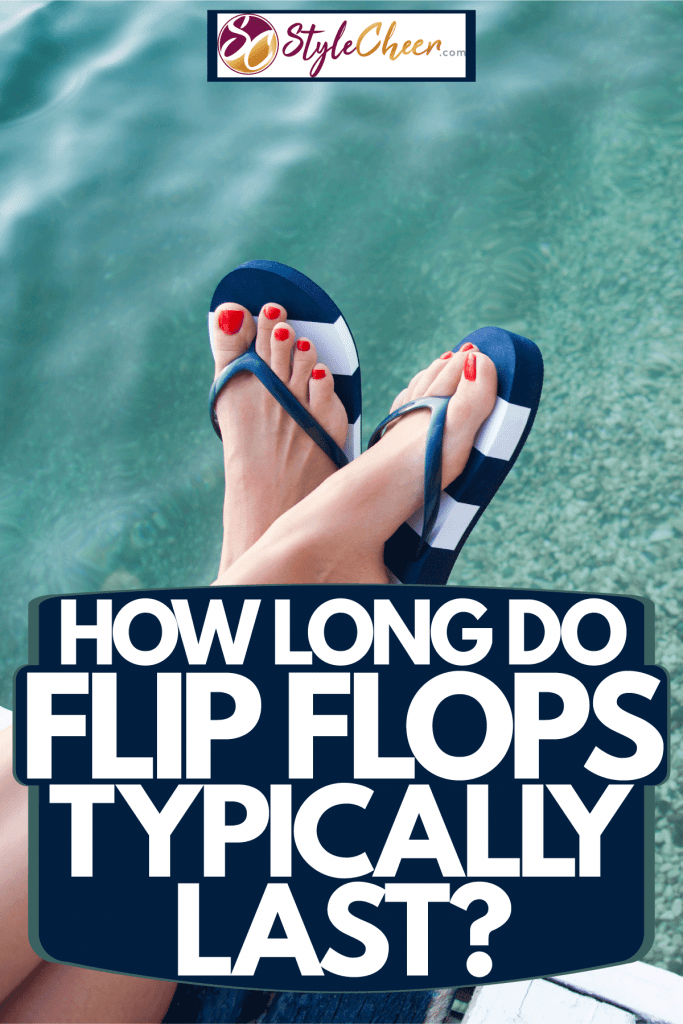 A woman wearing a blue and white stripped flip flop on the beach, How Long Do Flip Flops Typically Last?