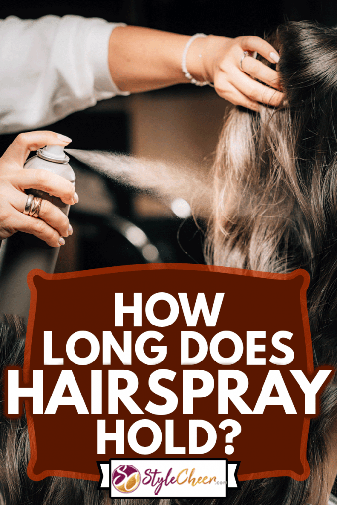 Hairdresser spraying woman’s long black hair with hair spray, How Long Does Hairspray Hold?