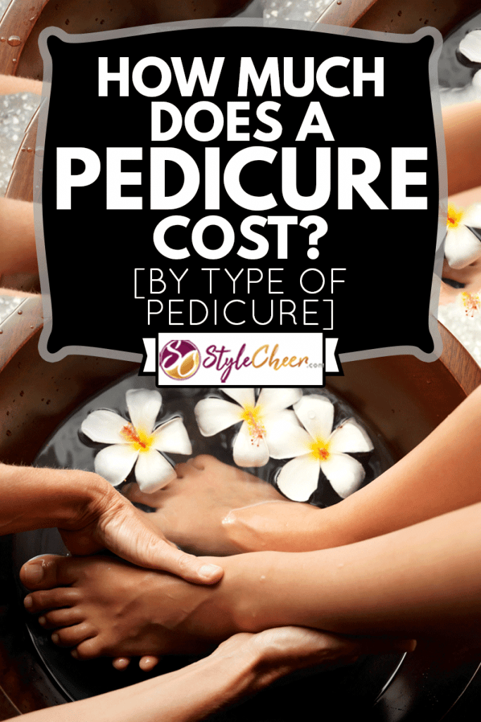 Female feet in foot bath with flowers getting a pedicure, How Much Does A Pedicure Cost? [By Type Of Pedicure]
