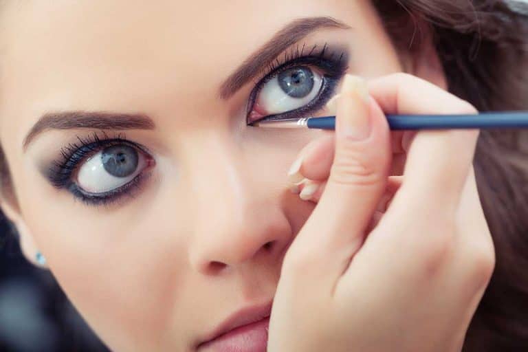Make-up artist applying liquid eyeliner with brush, How Long Does Liquid Eyeliner Last?