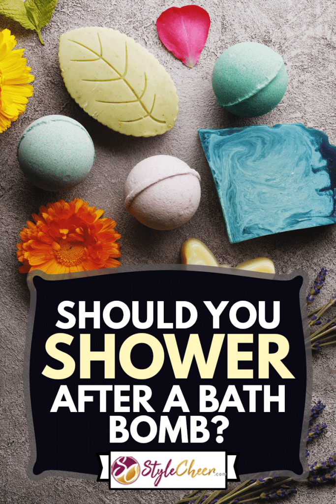 Bath spa accessories on rustic background, colorful bath bombs and soap bars with flowers and herbs, Should You Shower After A Bath Bomb?