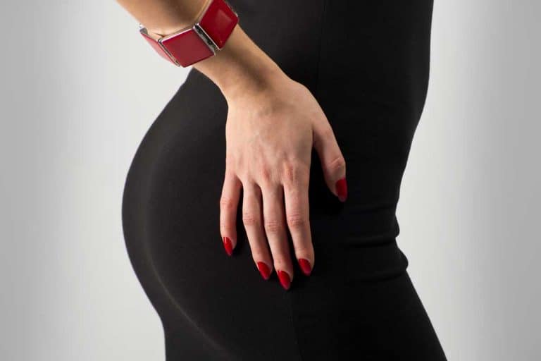 Woman in black dress and red nails, What Color Nails With A Black Dress?
