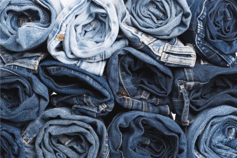 blue jeans rolled and stacked on top of each other. How To Make A Midi Skirt Out Of Jeans
