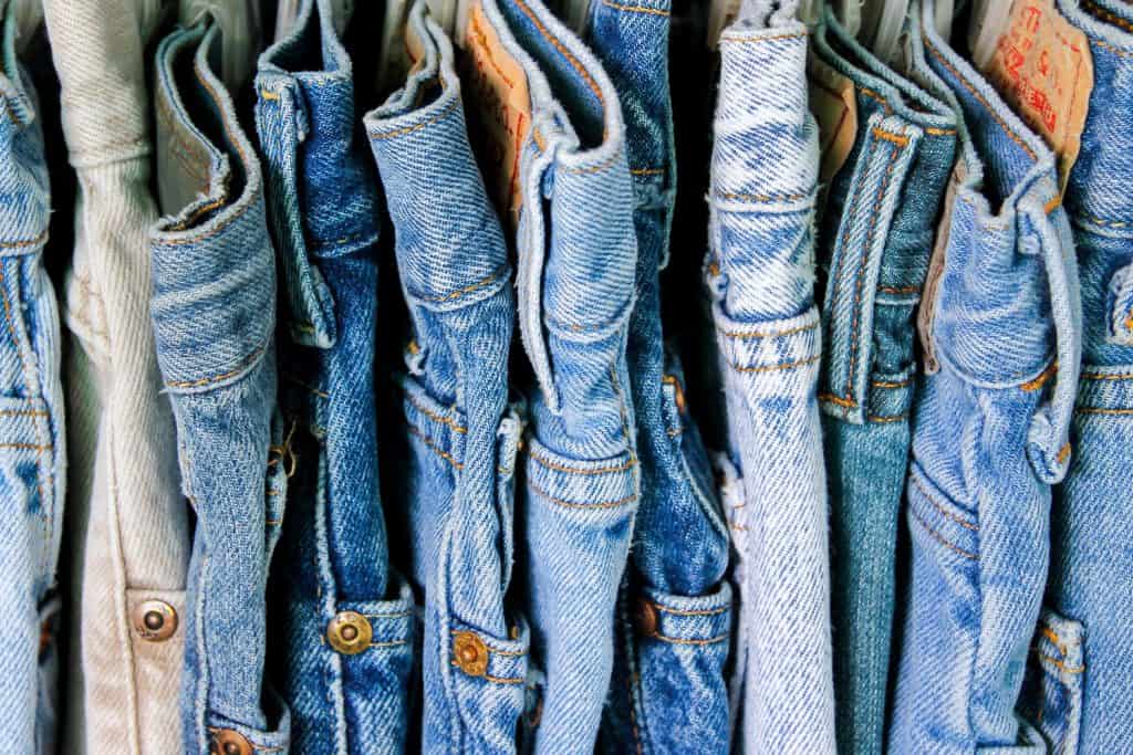 A rack of second hand jeans