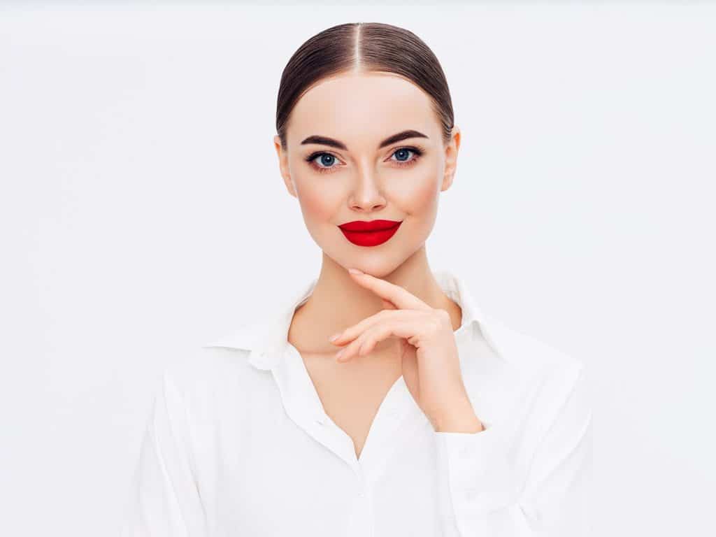 Beautiful woman with red lips on white background