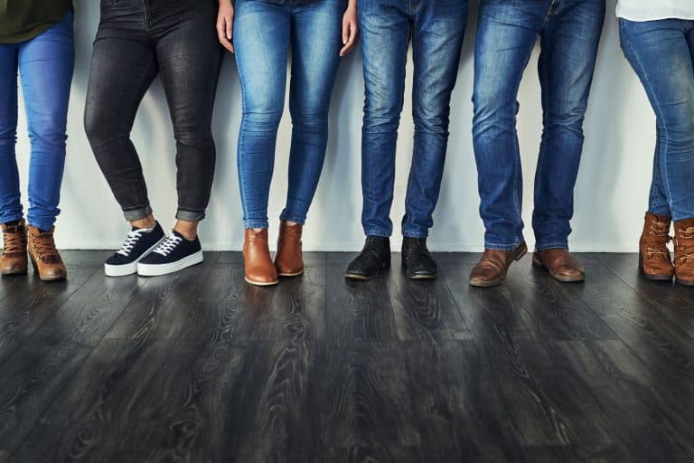 Cropped shot of a group of unrecognizable people wearing jeans while standing in a row, How Long Do Jeans Typically Last?