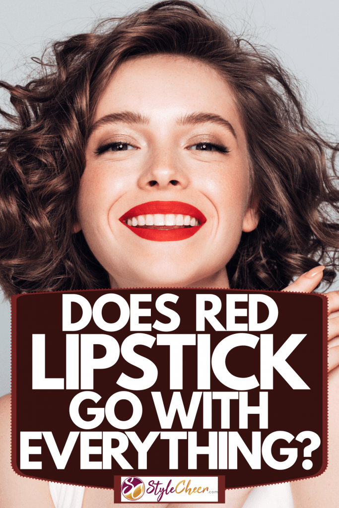 A beautiful curly haired woman wearing a white top and red lipstick, Does Red Lipstick Go With Everything?
