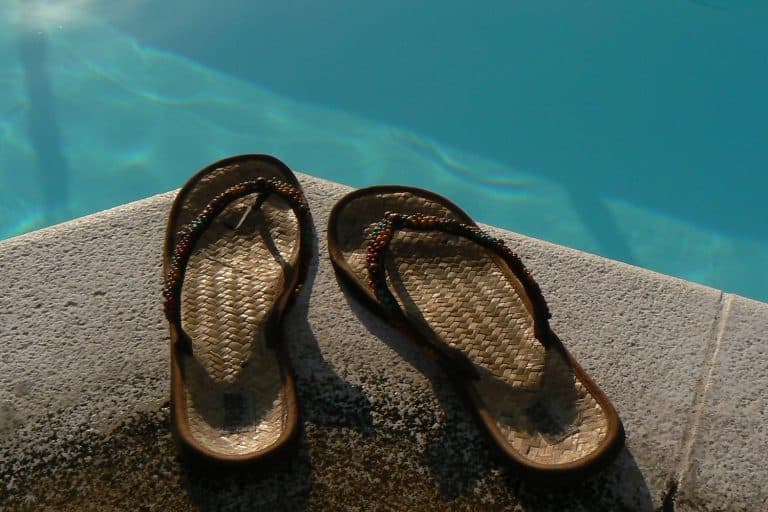 Female's flip flop on the edge of the pool, Do Flip Flops Stretch?