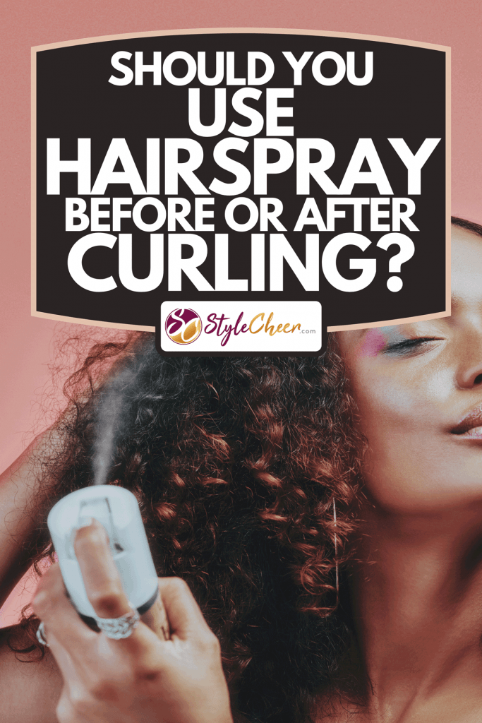 A cropped shot of a young woman spraying hairspray on her curly hair, Should You Use Hairspray Before Or After Curling?
