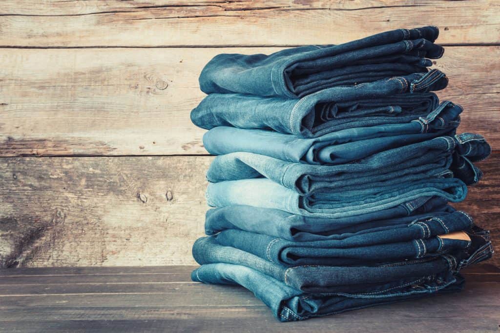 Stacked fashion blue jeans in store