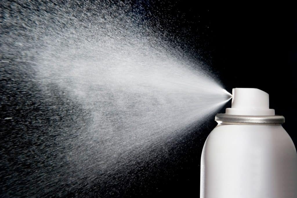 A hairspray spraying mist photographed at highspeed