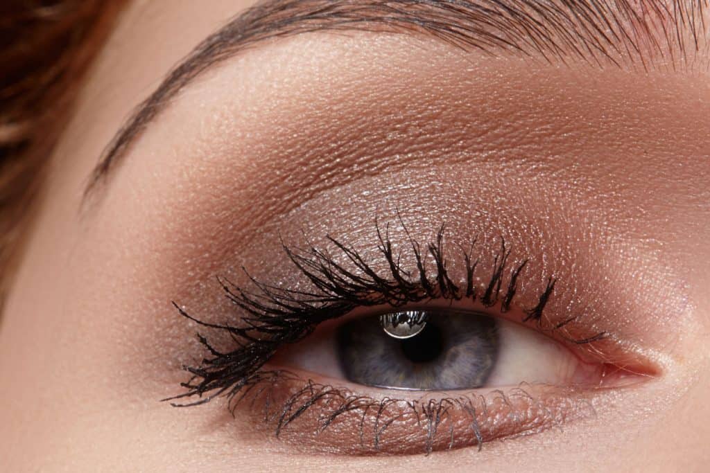 An up close photo fo a woman wearing nude color eyeshadow
