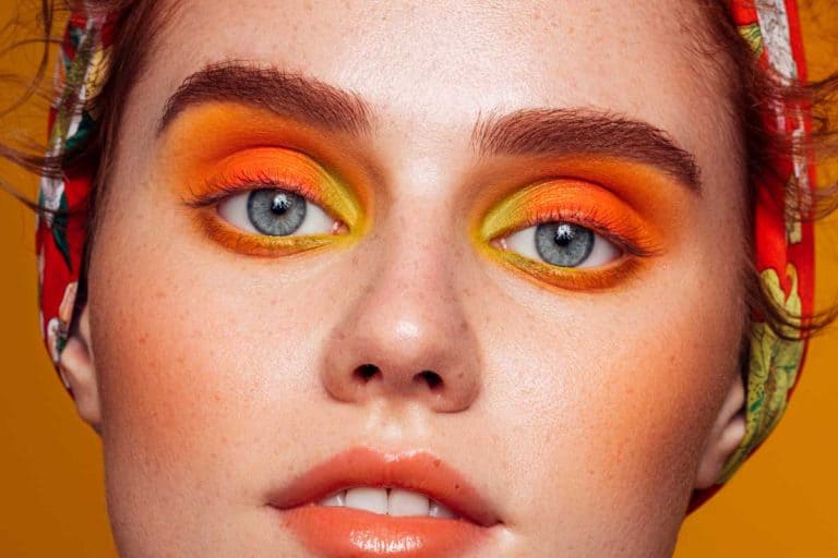 Beautiful woman with bright orange make-up, What Color Eyeshadow For Hooded Eyes?