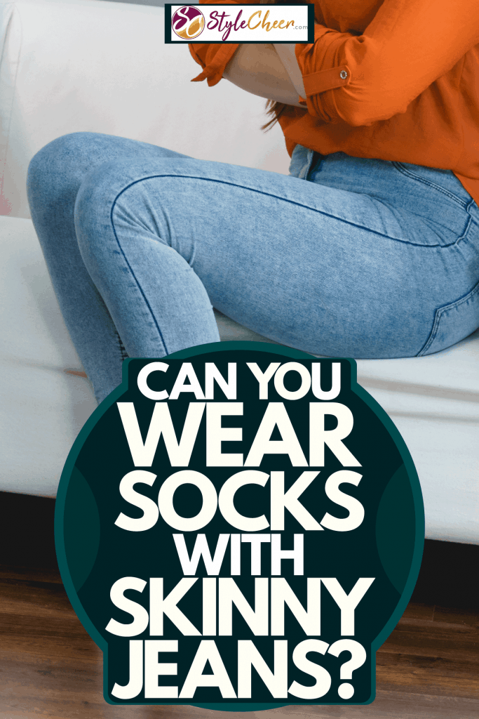A woman wearing skinny jeans inside her house, Can You Wear Socks With Skinny Jeans?