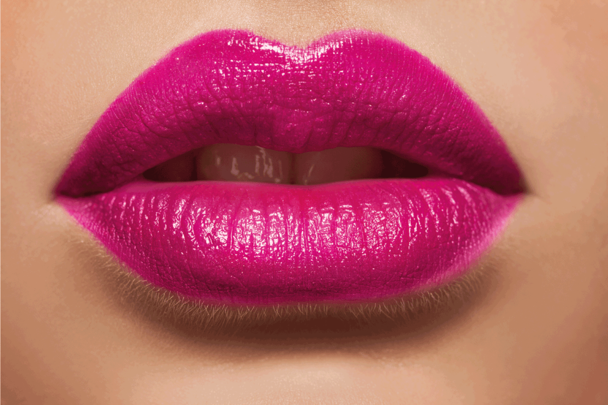 Macro photo of women's lips with pink lipstick