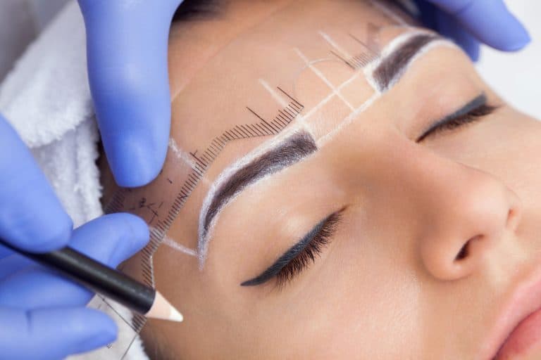 A beautiful woman getting a permanent eyebrow make up, Can Microblading Fix Uneven Eyebrows?