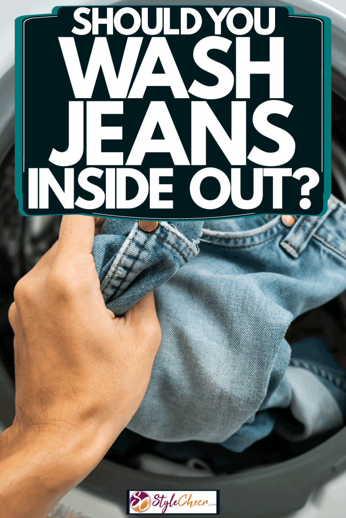 A woman putting her jeans inside the washing machine, Should You Wash Jeans Inside Out?