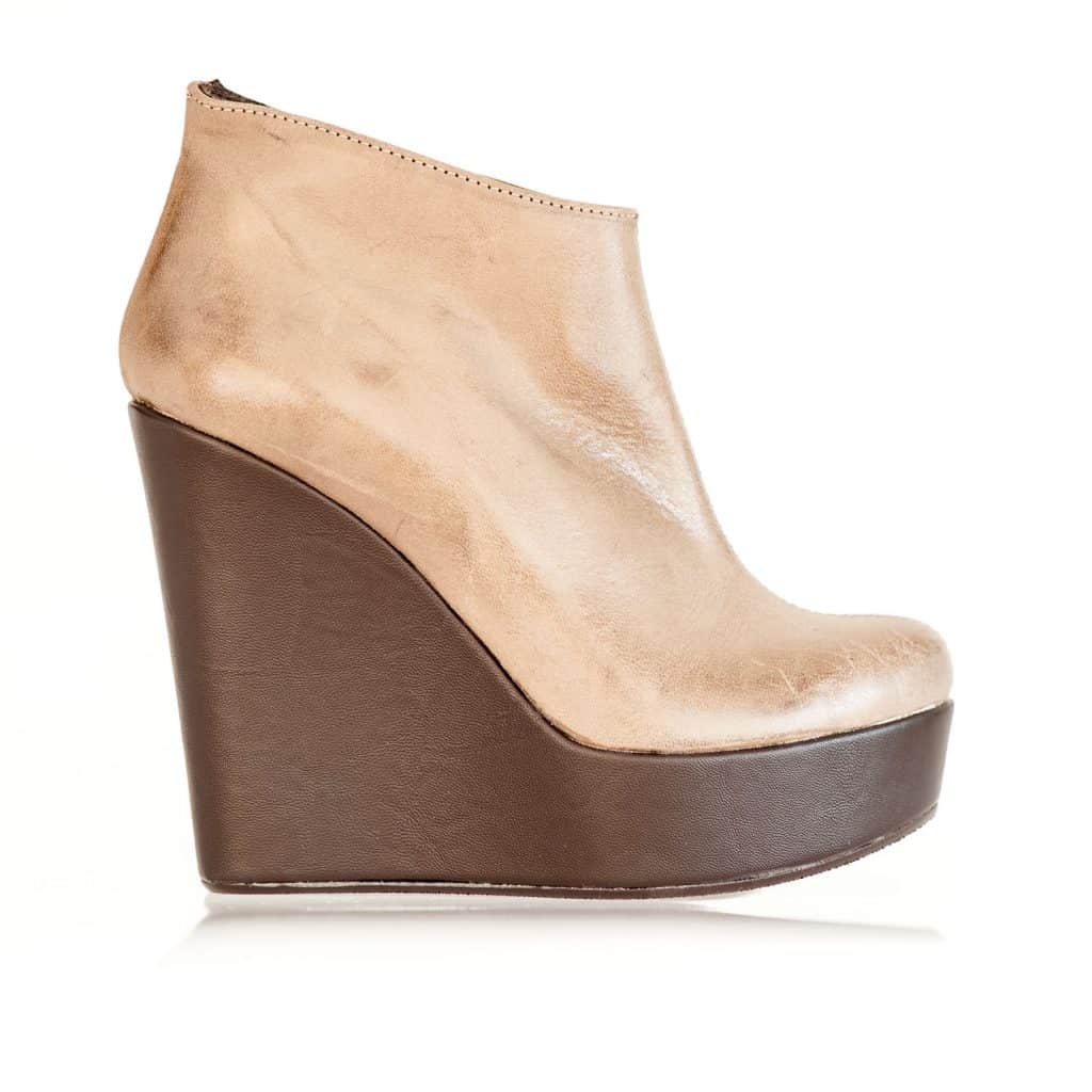 Brown wedge sandal on a white background