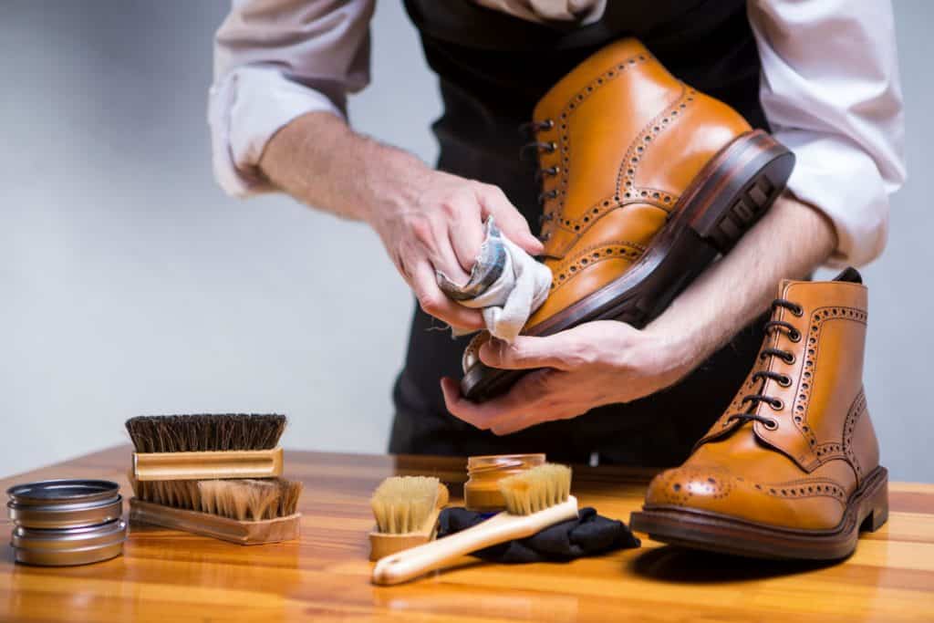  Extreme Close Up of Mans Hands Cleaning Luxury Calf Leather Brogues with Special Accessories, Shoe Wax and Tools