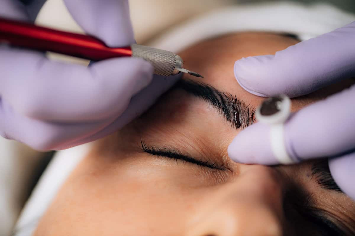 A beautiful woman getting her eyebrows microbladded