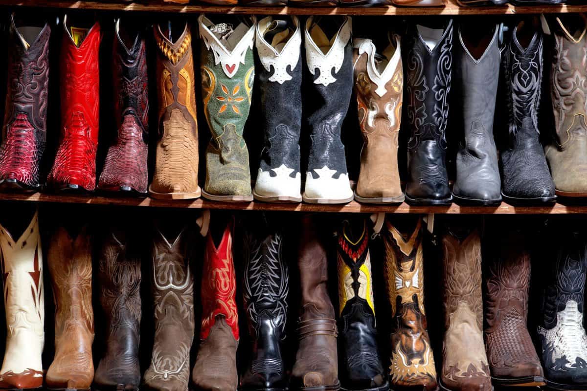 Leather cowboy boot collection at a shoe shelf