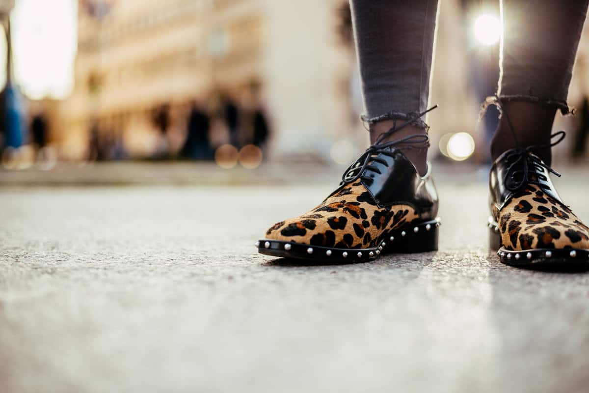 Stylish man wearing leopard shoes