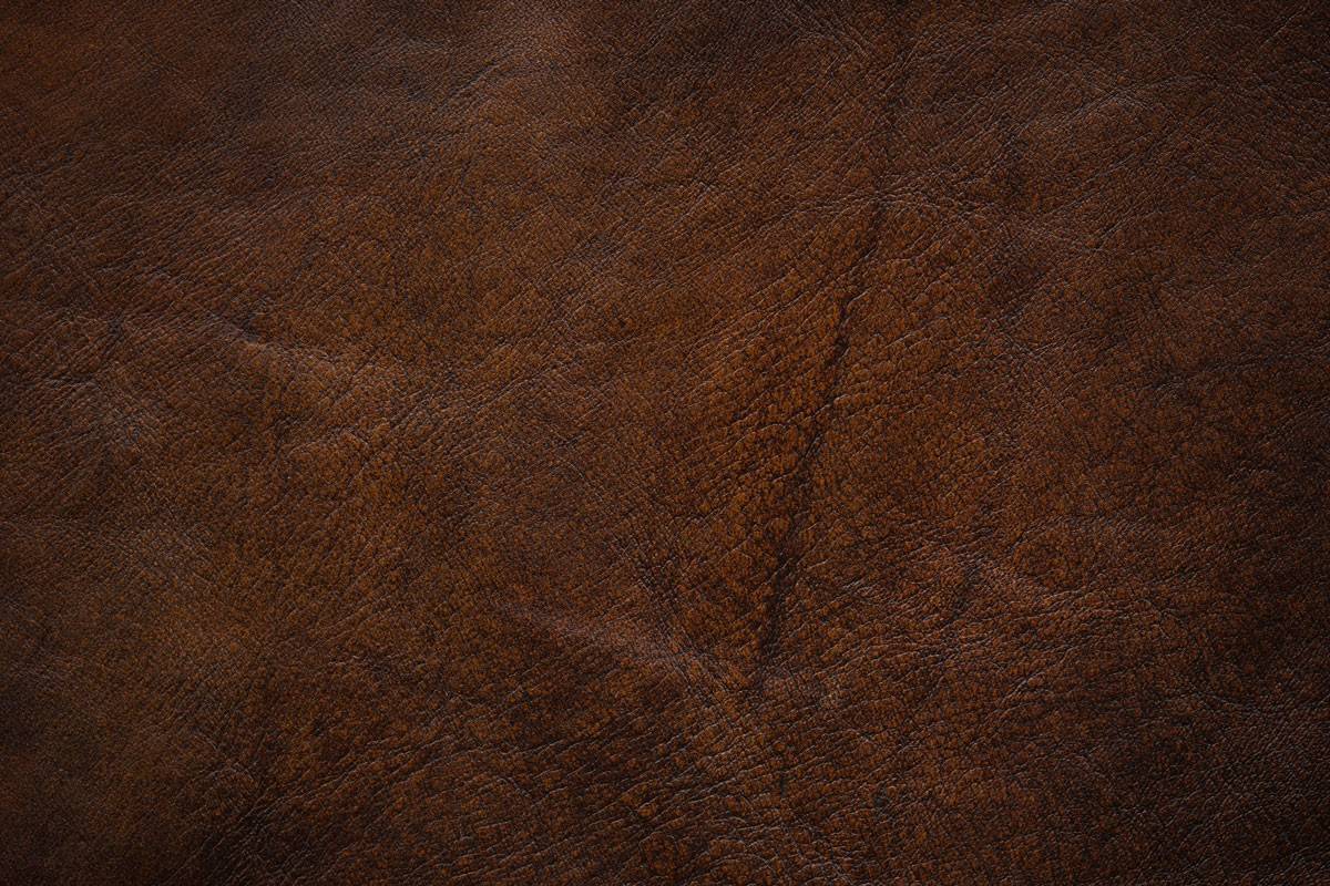 Dark brown leather with visible lines and marks