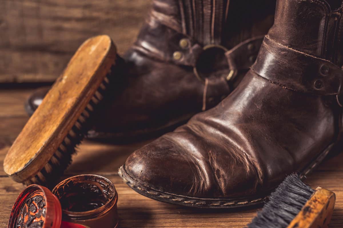 Restoring old and damaged leather shoes on a table