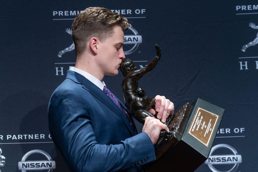 Quarterback Joe Burrow of the LSU Tigers winner of the 85th annual Heisman Memorial Trophy poses with trophy at the Marriott Marquis Hotel