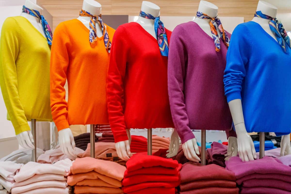 Women's cashmere pullovers on mannequins, fashion background. Colorful Pulli in shop