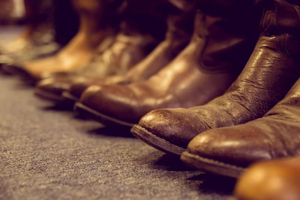 brown vintage leather boots aligned selective focus
