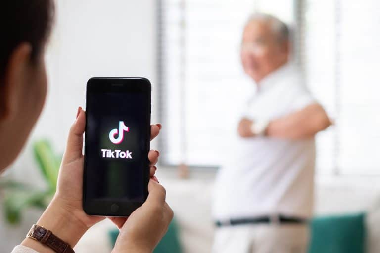 Using a mobile phone to take a video clip of senior people dancing to share on the TikTok application, TikTok Grandpa Takes The Fashion World By Storm With His Nike Dunks