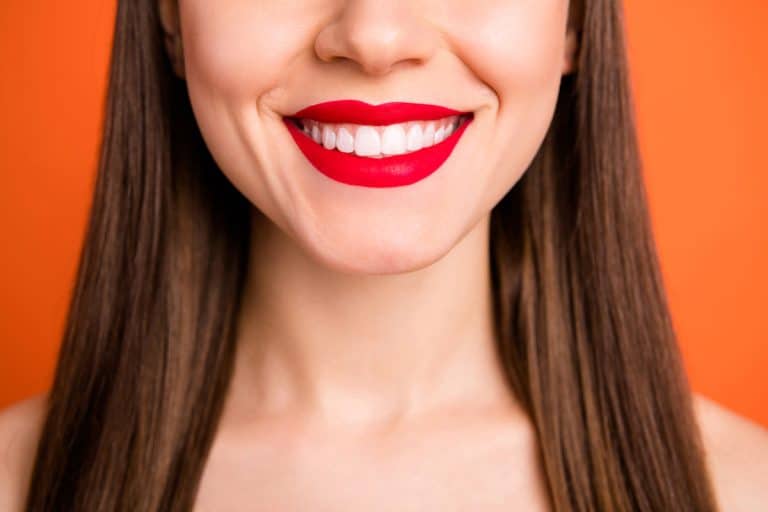 attractive lady bright red pomade amazing celebrity smile half face dentistry, From Plump Cheeks to Chiseled Features: The Risks and Rewards of Buccal Fat Removal