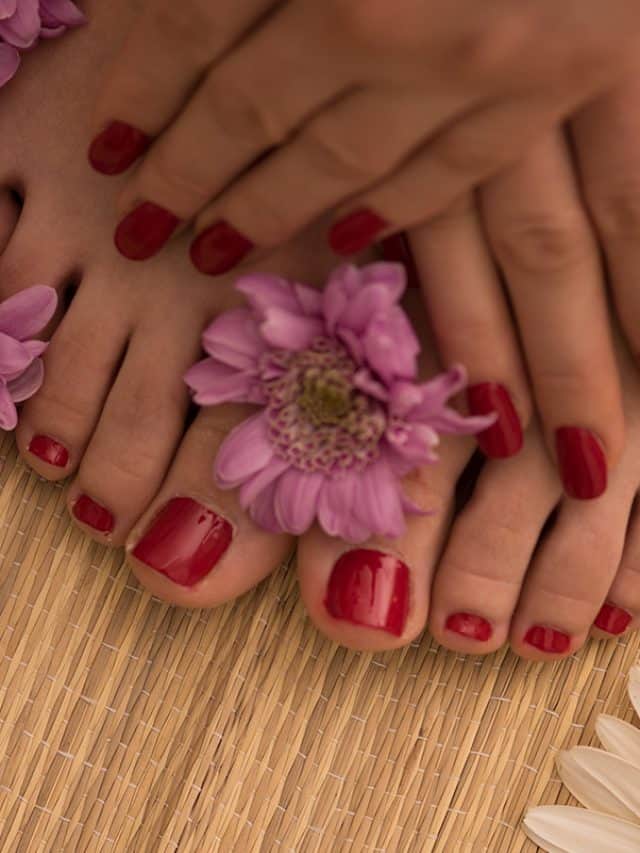 A female feet and hands at spa salon on pedicure and manicure procedure